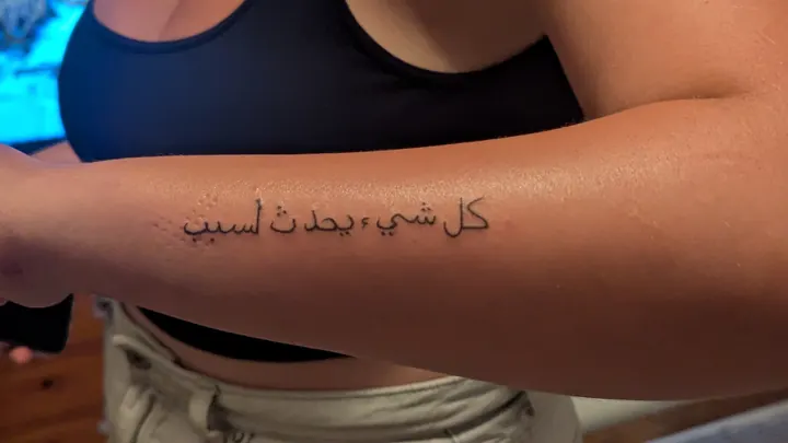 Arabic script along the forearm
