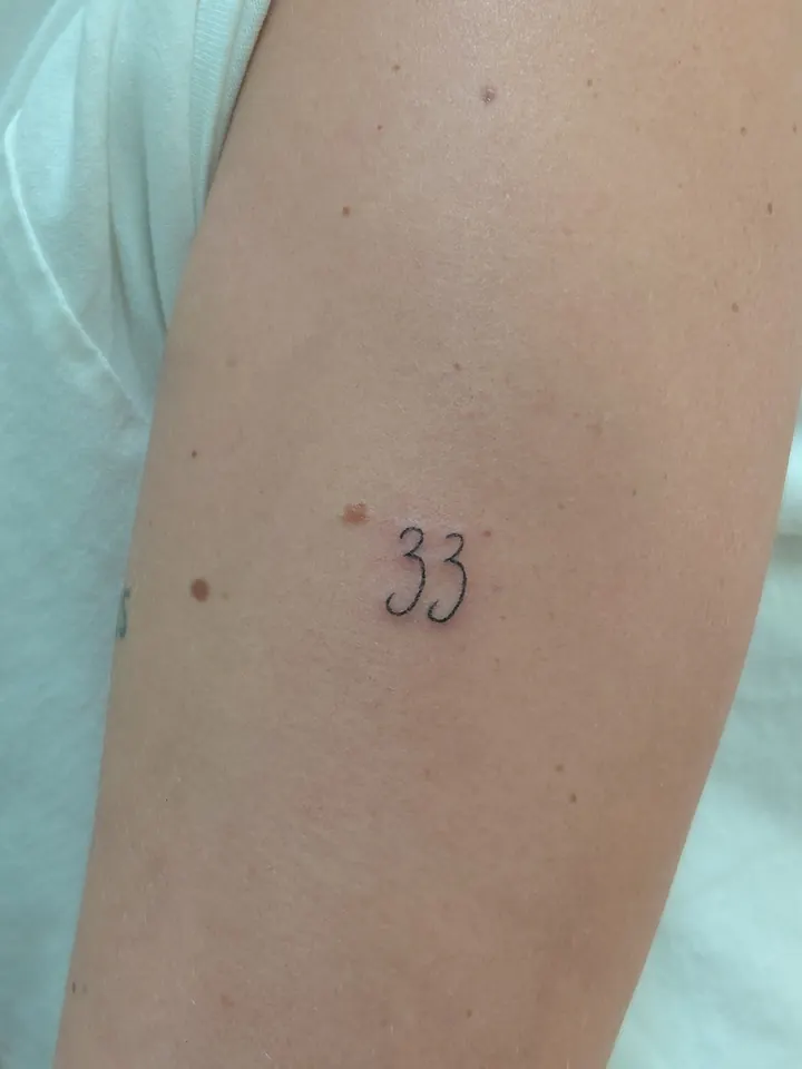 The number 33 on the arm