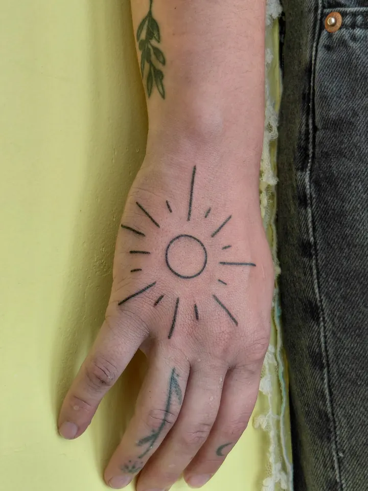 Sun outline on the back of the hand